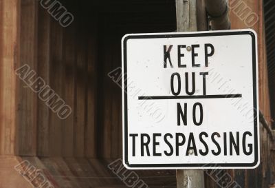 Keep Out Sign and Abandoned Building