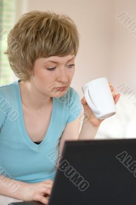 young woman working on a laptop