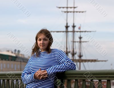 Beauty girl in sailor`s striped vest