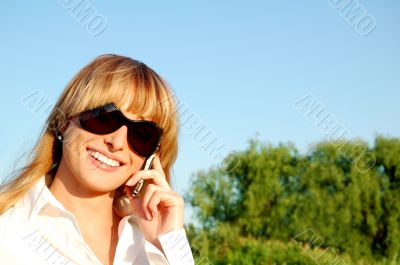 Beautiful young woman speaking the phone