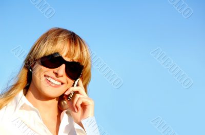 Beautiful young woman speaking the phone