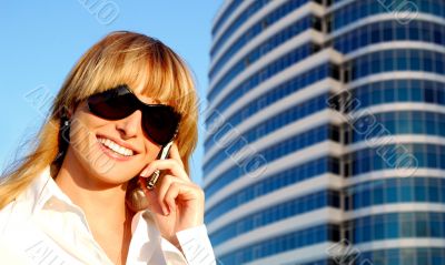 Beautiful young woman speaking the phone Beautiful young woman speaking the phone