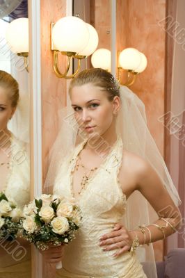 The bride near a mirror