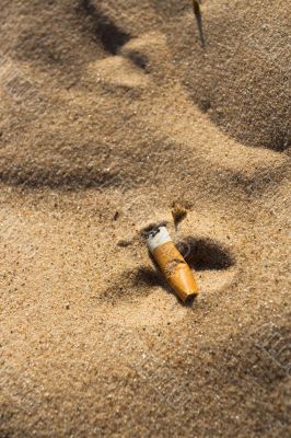 Cigarette butt in sand