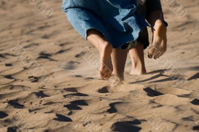 Barefoot legs on the sand beach Barefoot legs on the sand beach