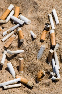 Cigarette butt in sand Cigarette butt in sand