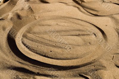 Cirlce in beach sand.