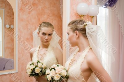 The bride near a mirror