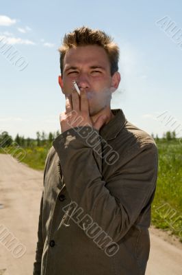 young man smokes young man smokes
