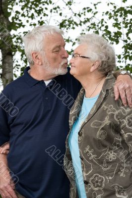 Older couple outside and in love