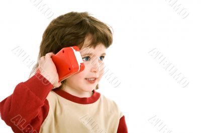 child with a toy telephone