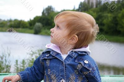 Girl near a beautiful lake