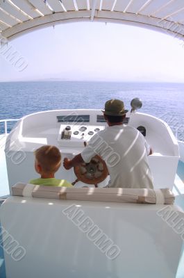 little boy and captain on the boat 2
