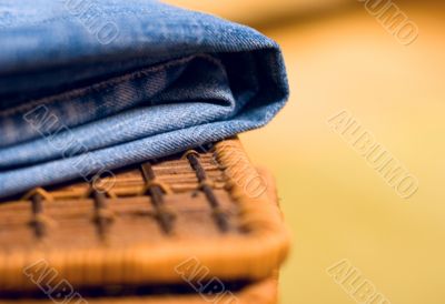jeans atop of a basket