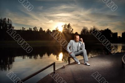 Businessman in white on the sunset