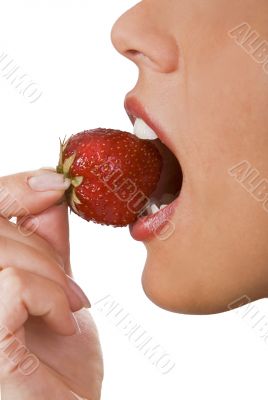 Biting into a strawberry