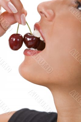 Biting into a cherry