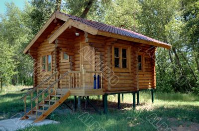 The wooden house with a porch.