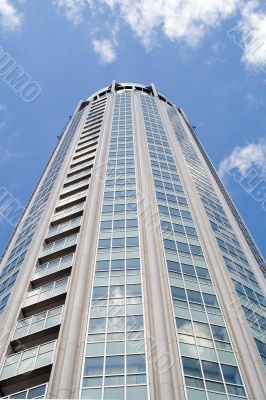 High modern building with reflecting windows.