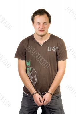 The guy chained in handcuffs. Isolated The guy chained in handcuffs. Isolated