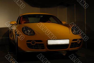 The yellow sports automobile. The yellow sports automobile.