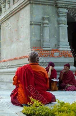 Buddhistic monk in front of stupa