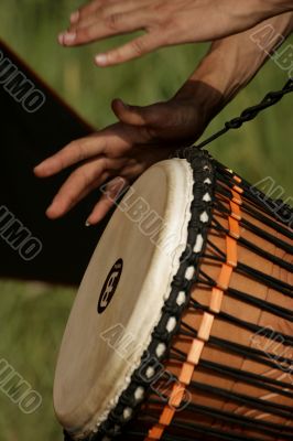 Hands of the person playing on a drum