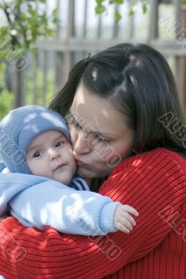  Mother Kissing Baby