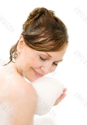 Attractive woman enjoys  in the bathtub.