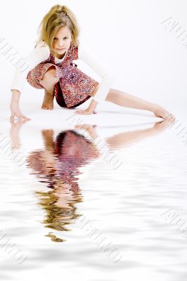 Blond child doing a yoga pose