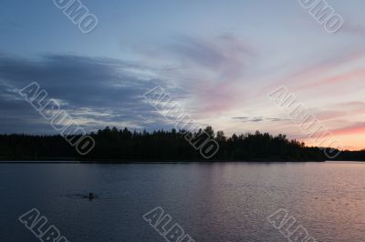 swimmer in night lake