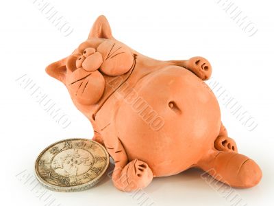 Clay fat cat with coin