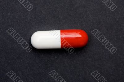 Red and white pill