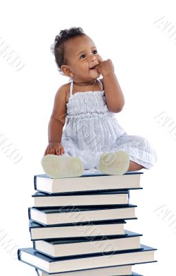 baby on a book tower