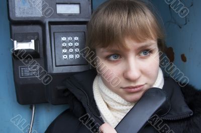 Upset girl with street phone