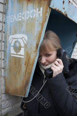 Upset girl with street phone