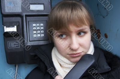 Upset girl with street phone