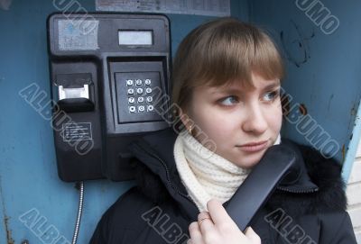 Upset girl with street phone