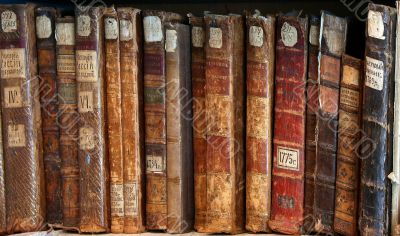 Row of old books cover spines