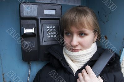 Upset girl with street phone