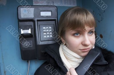 Upset girl with street phone