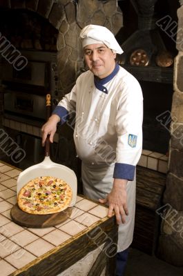 portrait of a chef in uniform.