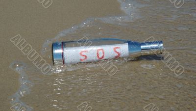 Message in a bottle with SOS signal