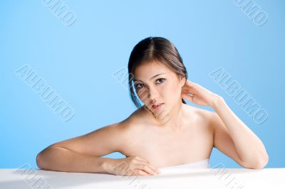 beautiful young asian girl  on blue background