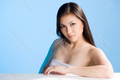 beautiful young asian girl  on blue background