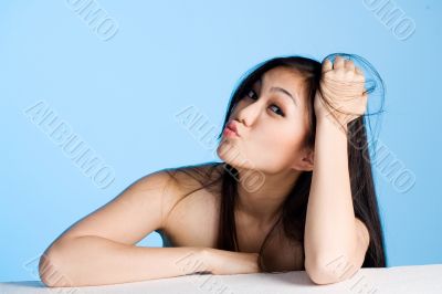 beautiful young asian girl  on blue background