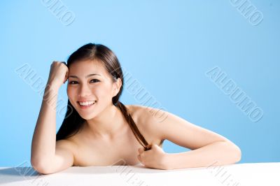 beautiful young asian girl  on blue background