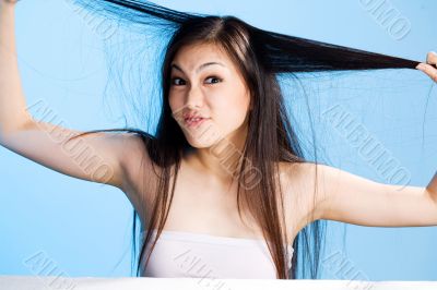 beautiful asian woman on blue background