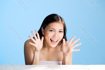 beautiful asian woman on blue background