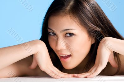 beautiful asian woman on blue background